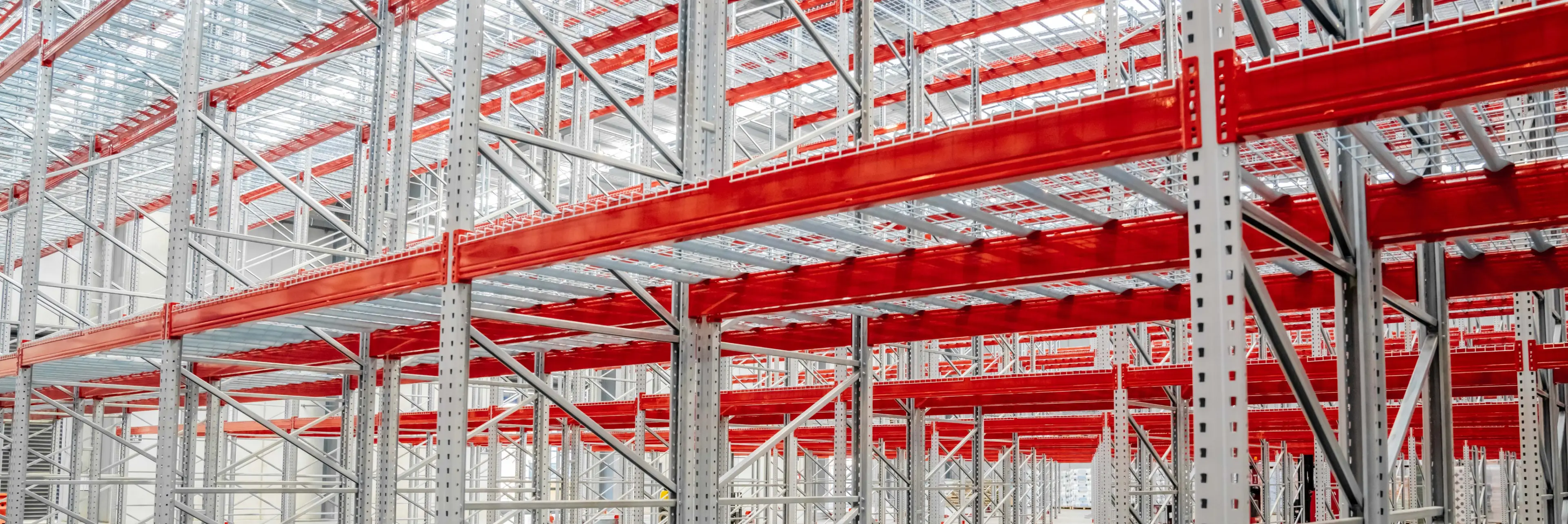 Heavy-duty pallet racking system with load capacity signage and safety information