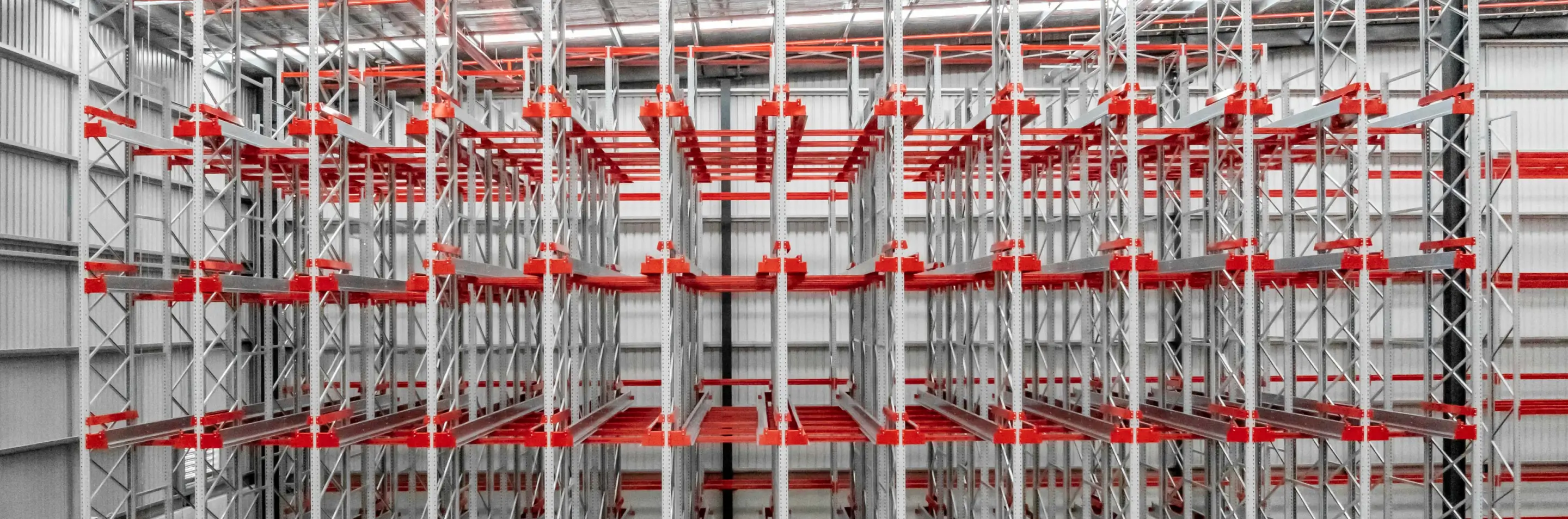 Warehouse team reviewing pallet racking component and layout plans