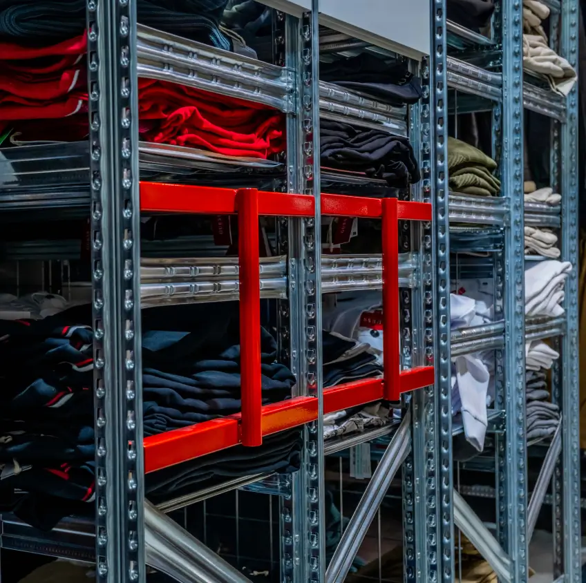 Retail shelving with safety rail system for secure stock storage