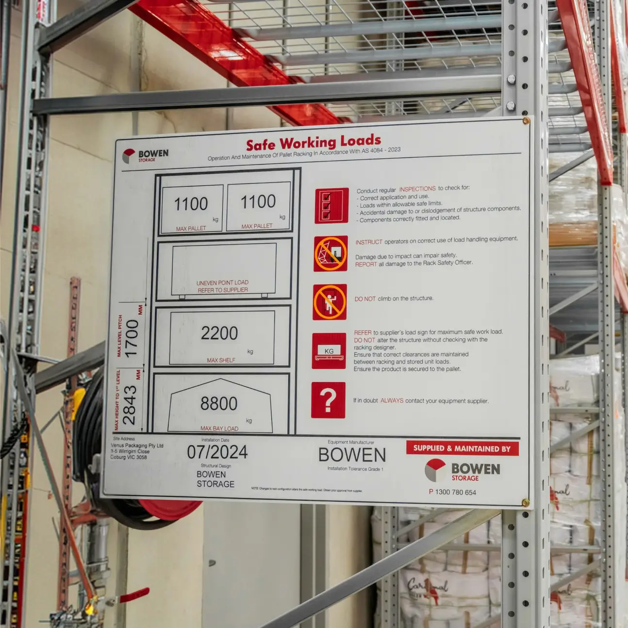 Warehouse aisle with pallet racking and aisle identification signage