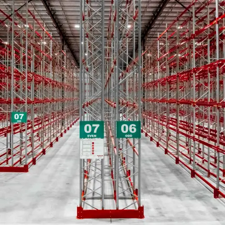 Warehouse shelving system with boxed inventory and access ladder