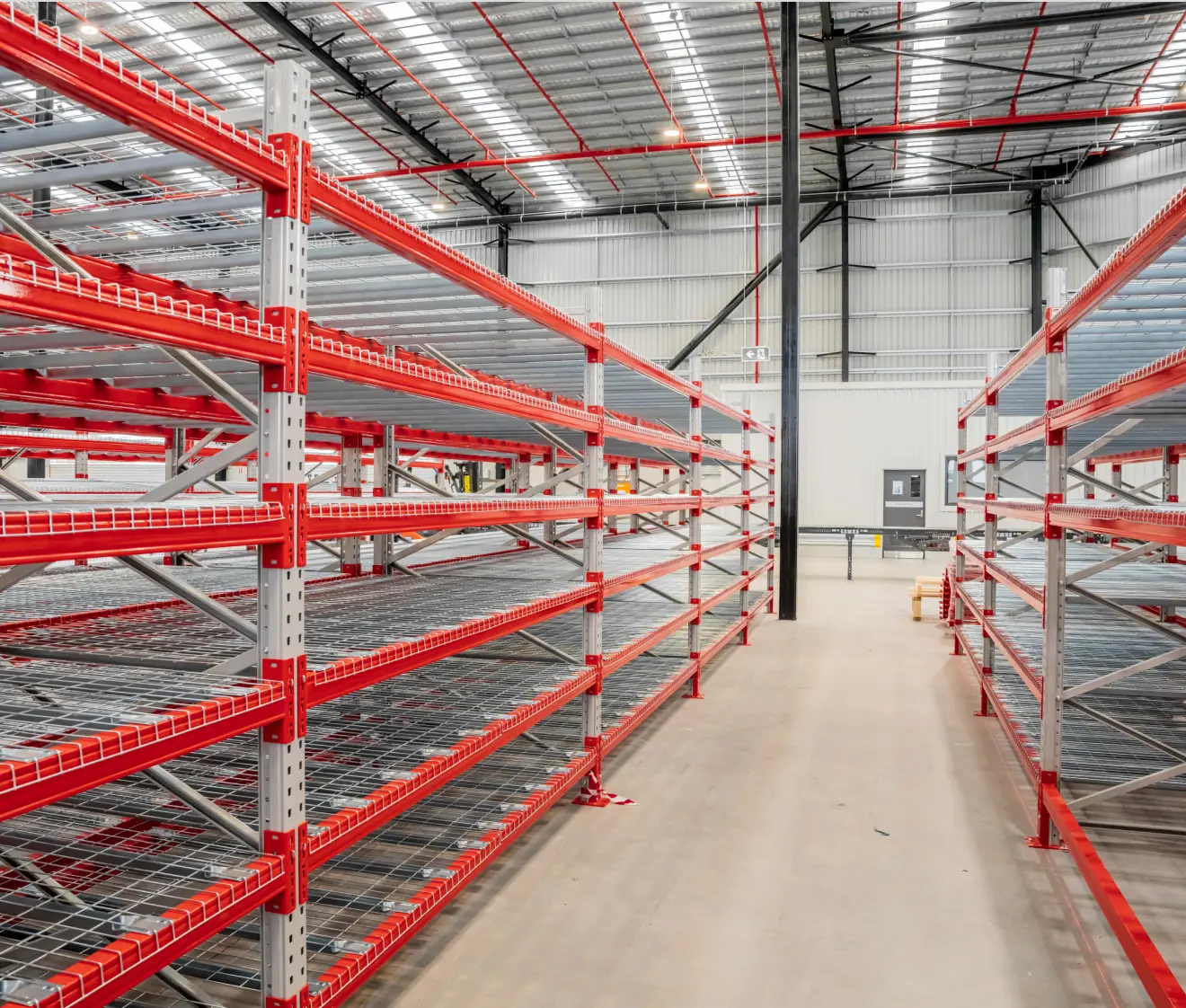 Industrial steel shelving system with multiple tiers for organised warehouse storage