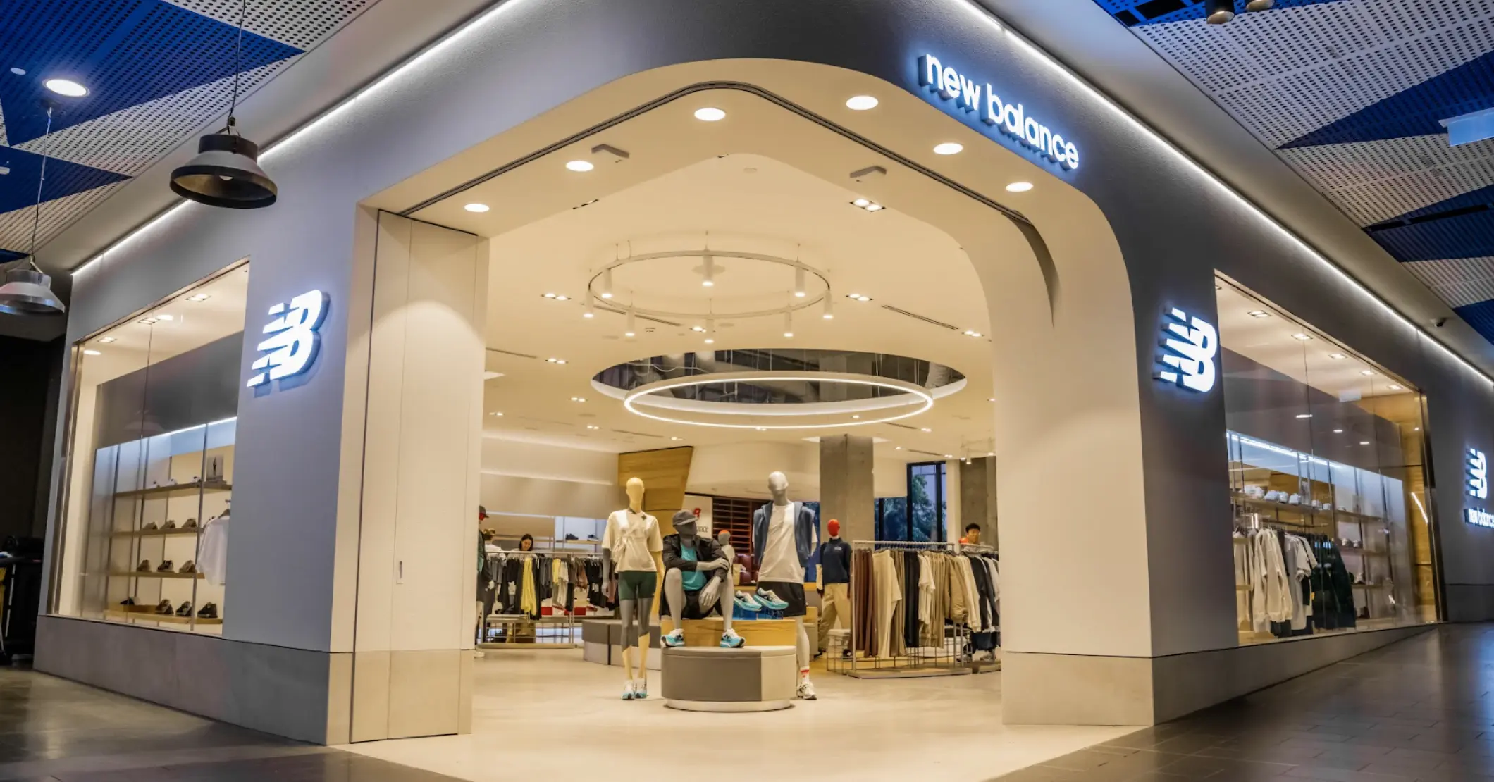 Modern retail store fitout with branded New Balance storefront and interior merchandising layout