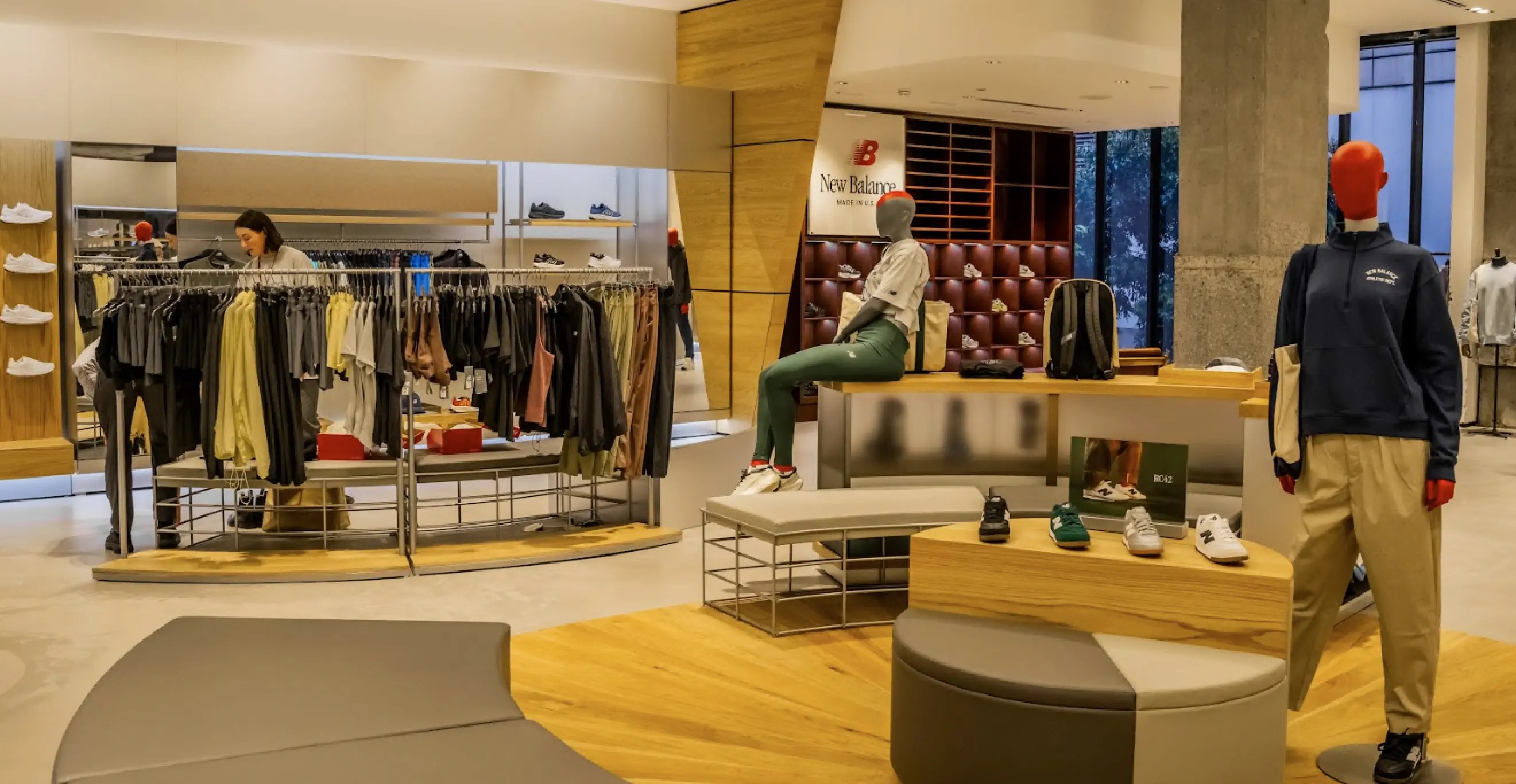 Retail showroom fitout with clothing displays, shelving systems, and open-plan customer layout