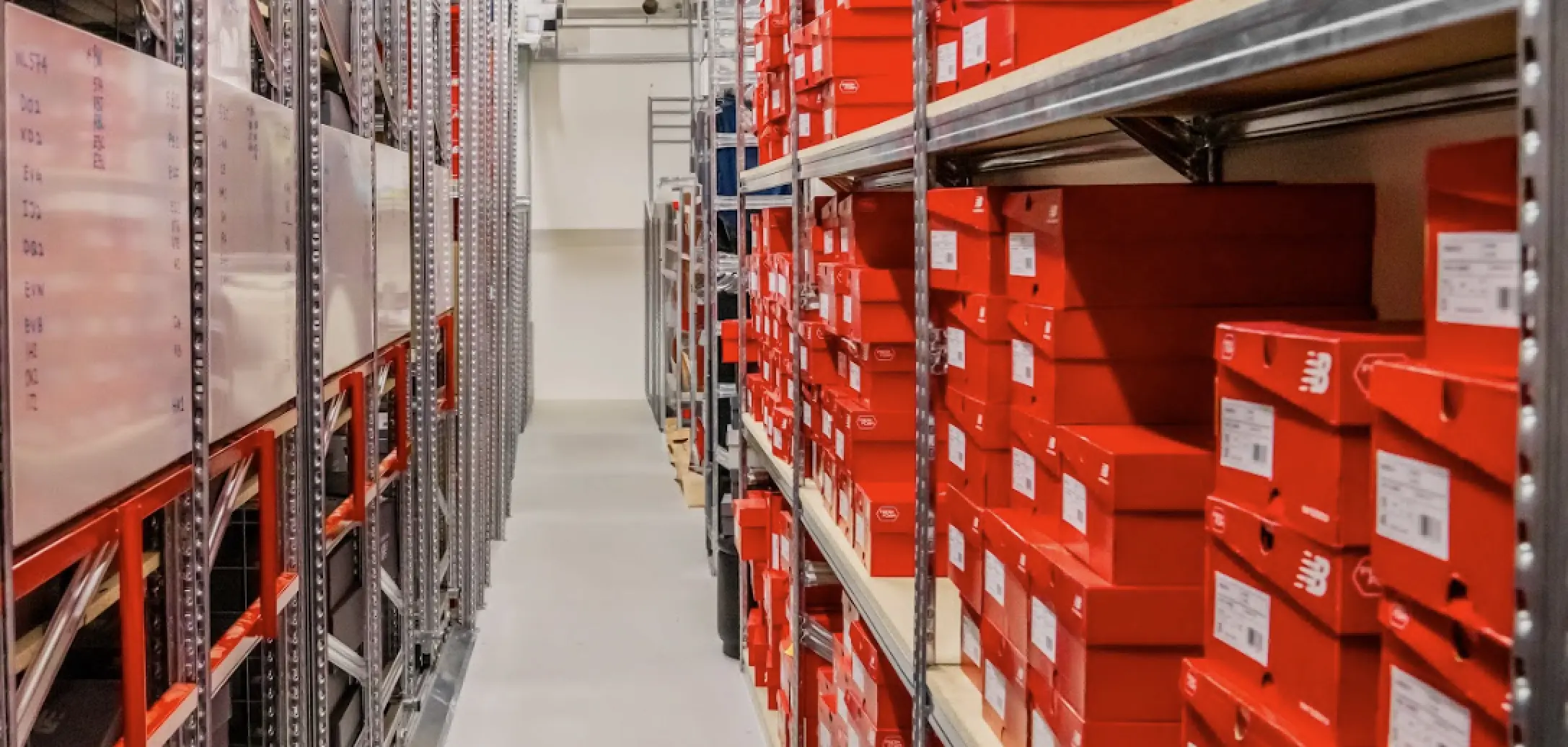 Modern retail store fitout with apparel display shelving and branded in-store merchandising