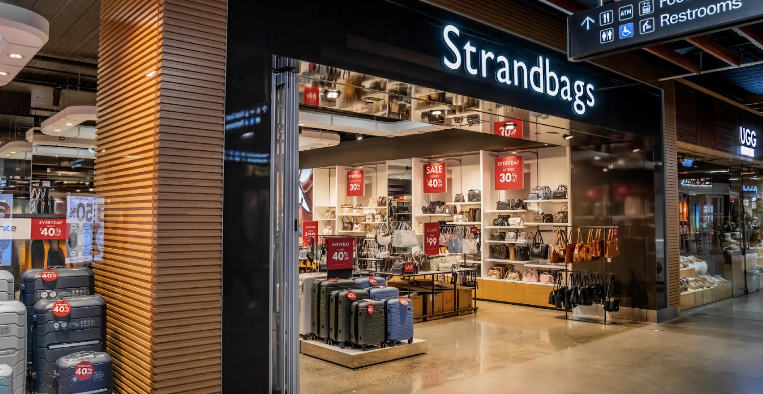 Retail storefront with luggage display and shopping centre fitout design