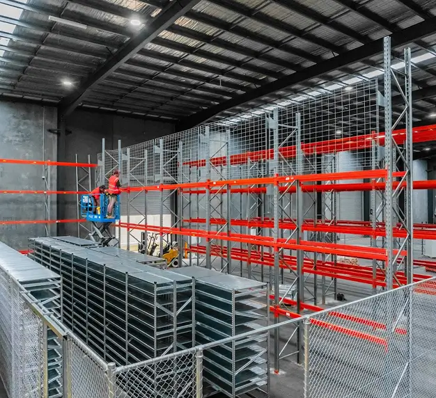 Warehouse pallet racking installation at Hallam Trucks facility with forklift access and storage system setup