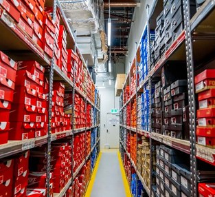 JD Sports stockroom fit-out with compactus and static shelving for shoe boxes and apparel across 60+ stores